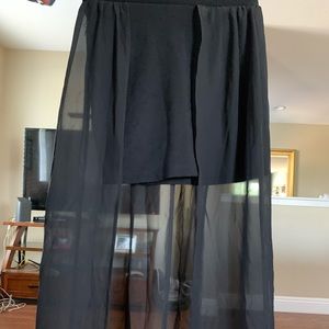 Fitted skirt with long sheer coverage in the back
